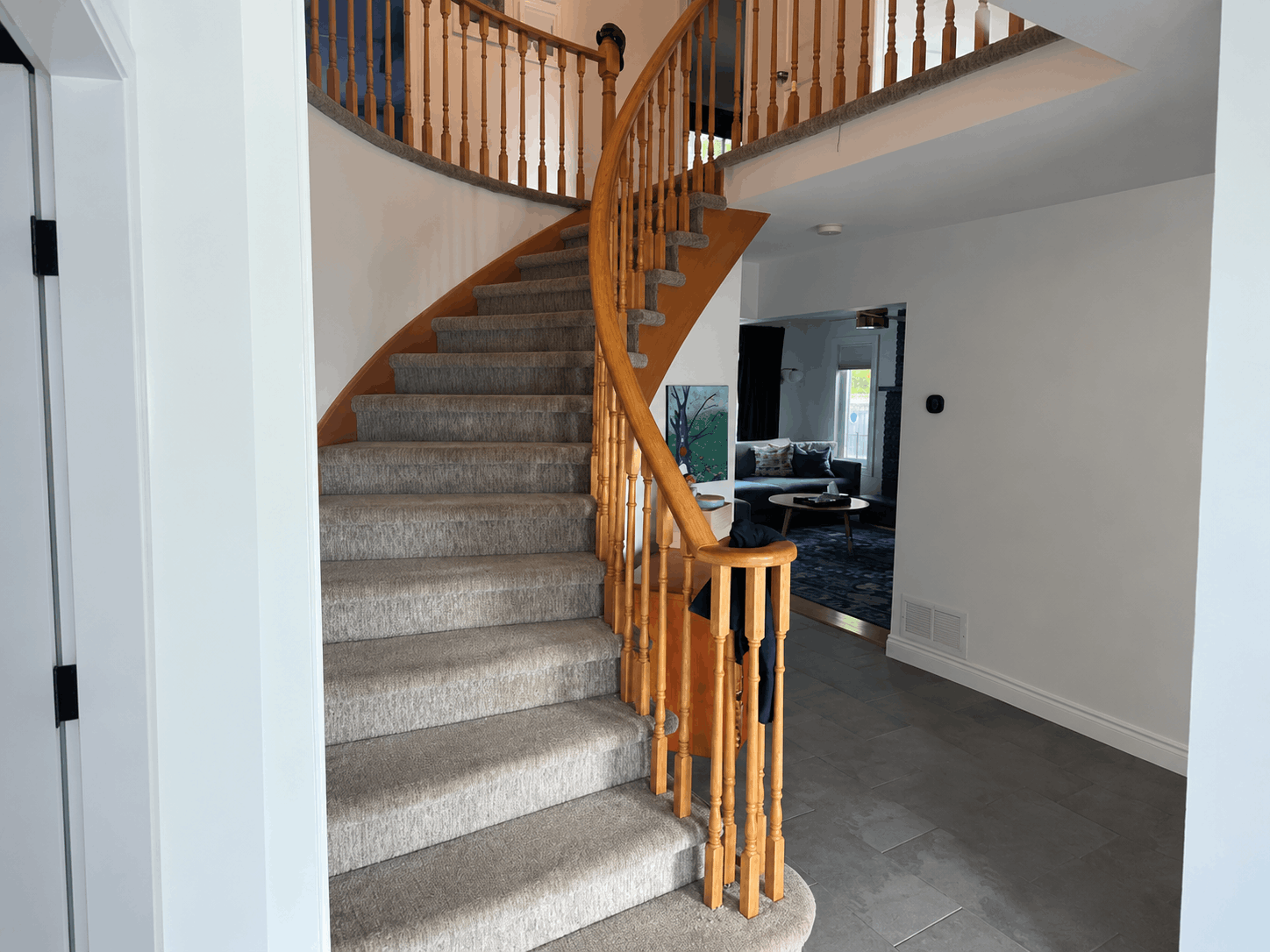Curved Oak Staircase Renovation with White Risers before